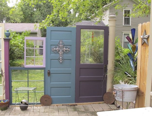 Fence with doors & windows facing the patio.